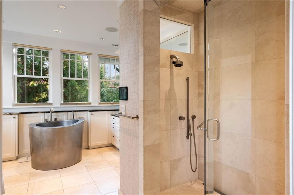 81 Peachtree Circle Northeast Atlanta, GA 30309 - Photo 27 of 54 a bathroom with a tub and shower