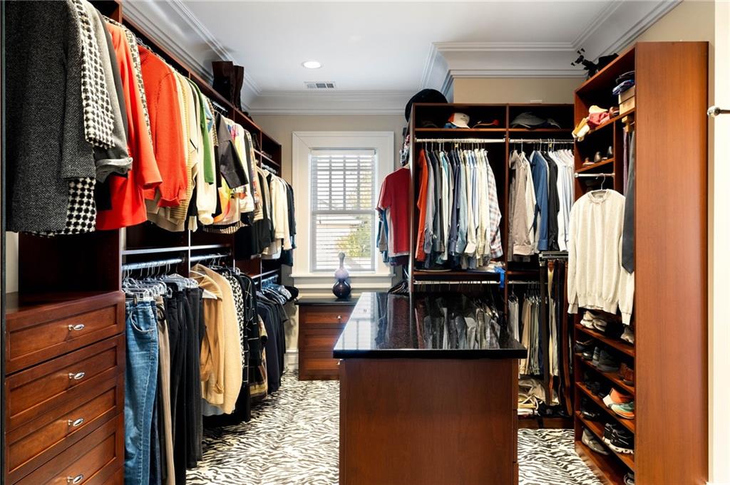 81 Peachtree Circle Northeast Atlanta, GA 30309 - Photo 28 of 54 a view of walk in closet with clothes and shoes