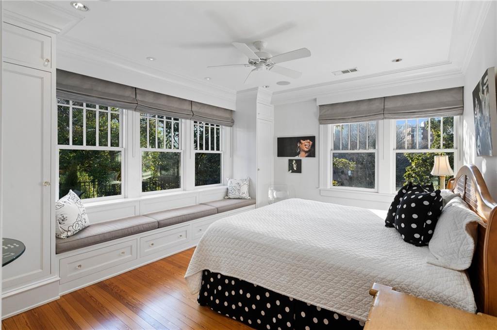 81 Peachtree Circle Northeast Atlanta, GA 30309 - Photo 30 of 54 a bed sitting in a bedroom next to a window