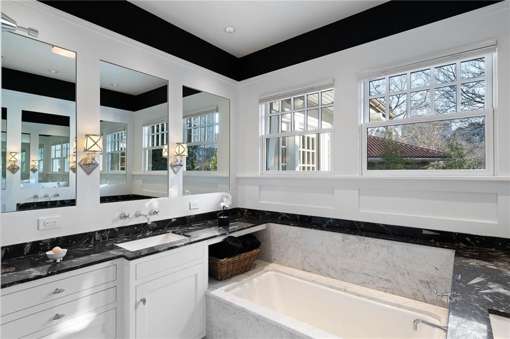 81 Peachtree Circle Northeast Atlanta, GA 30309 - Photo 31 of 54 a large white kitchen with a large window