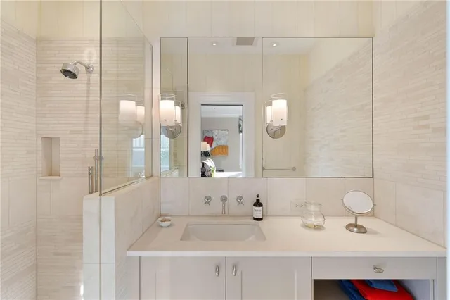 a bedroom with a large bed and a large window