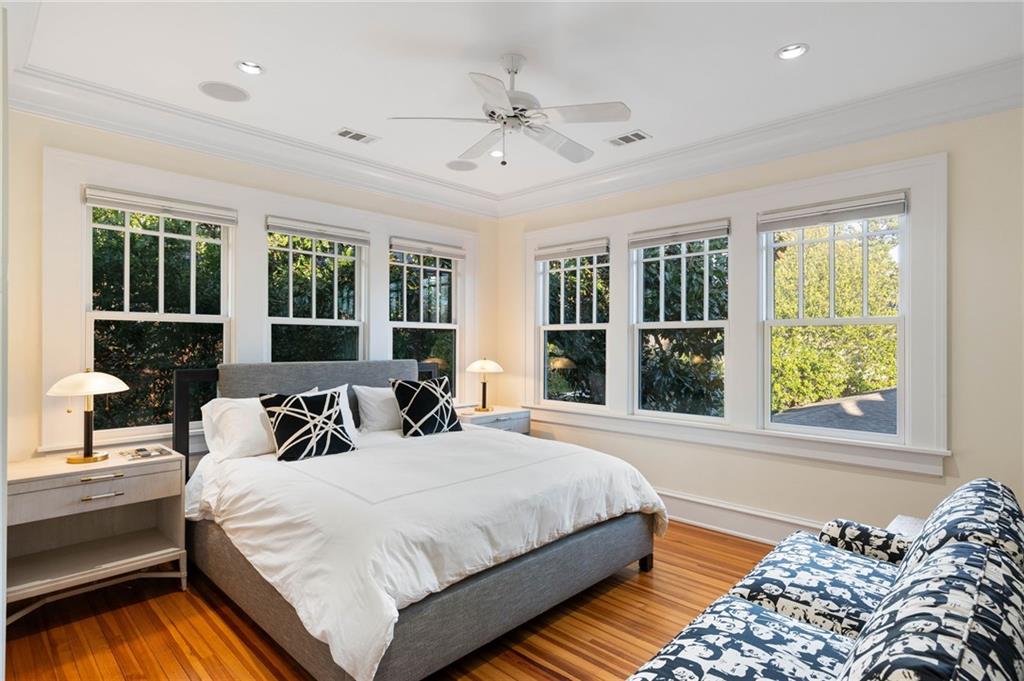 81 Peachtree Circle Northeast Atlanta, GA 30309 - Photo 35 of 54 a bedroom with a large bed and a large window