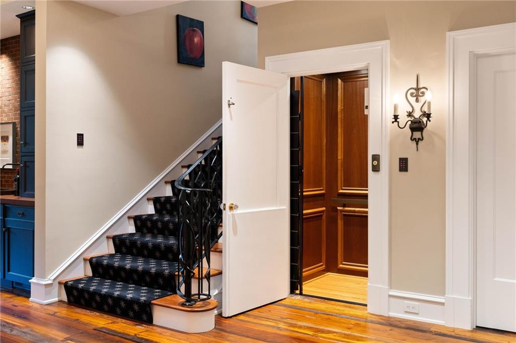 81 Peachtree Circle Northeast Atlanta, GA 30309 - Photo 37 of 54 a view of entryway and hall with wooden floor