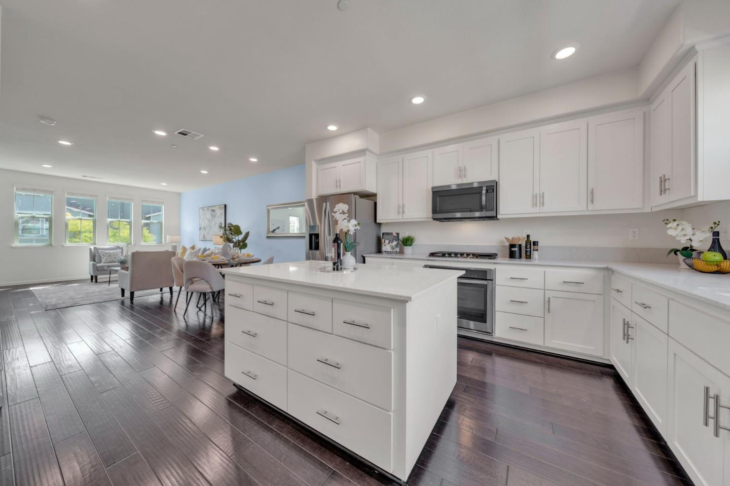 103 Cypress Loop Hayward, CA 94544 - Photo 17 of 55 a kitchen with white cabinets sink and stainless steel appliances