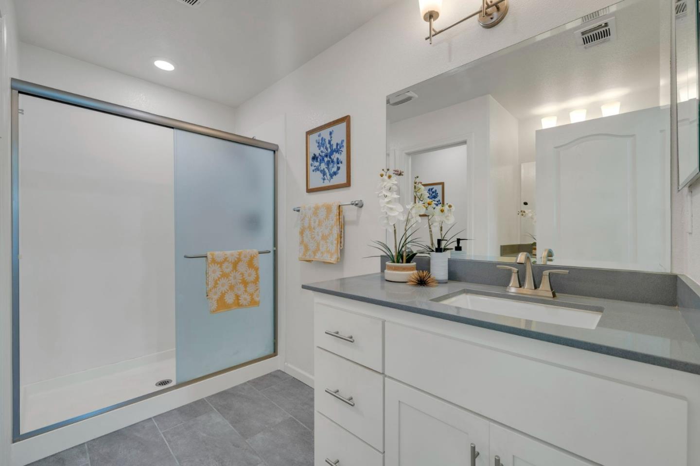 103 Cypress Loop Hayward, CA 94544 - Photo 27 of 55 a bathroom with a double vanity sink and a mirror