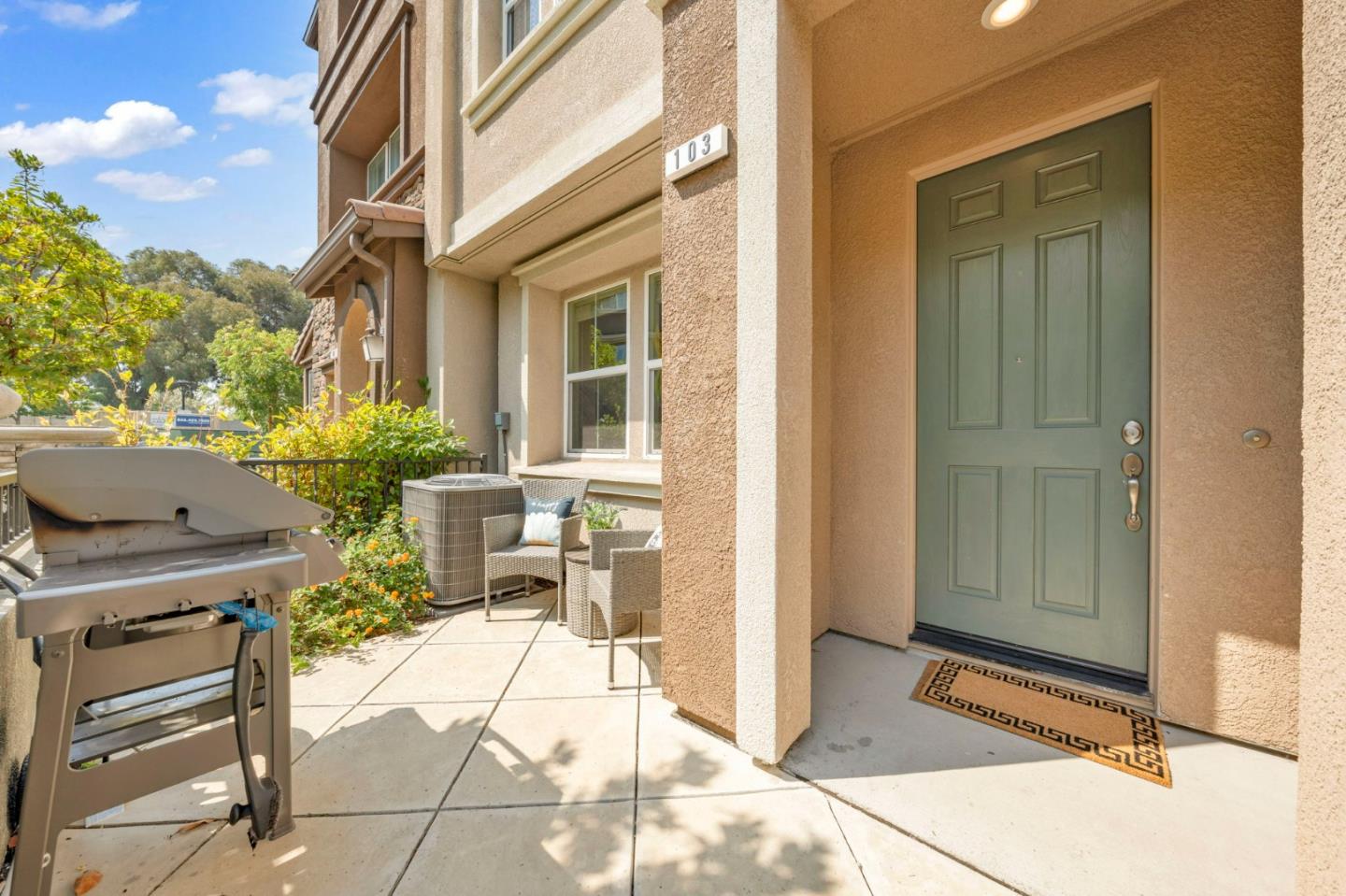 103 Cypress Loop Hayward, CA 94544 - Photo 38 of 55 a patio with table and chairs and potted plants