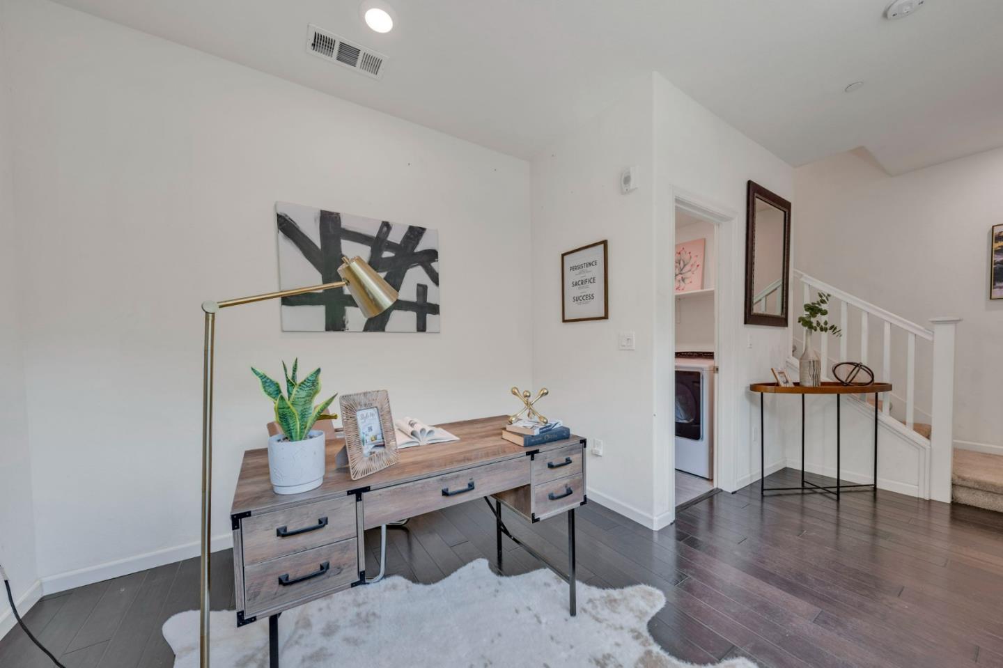 103 Cypress Loop Hayward, CA 94544 - Photo 7 of 55 a workspace with furniture and wooden floor