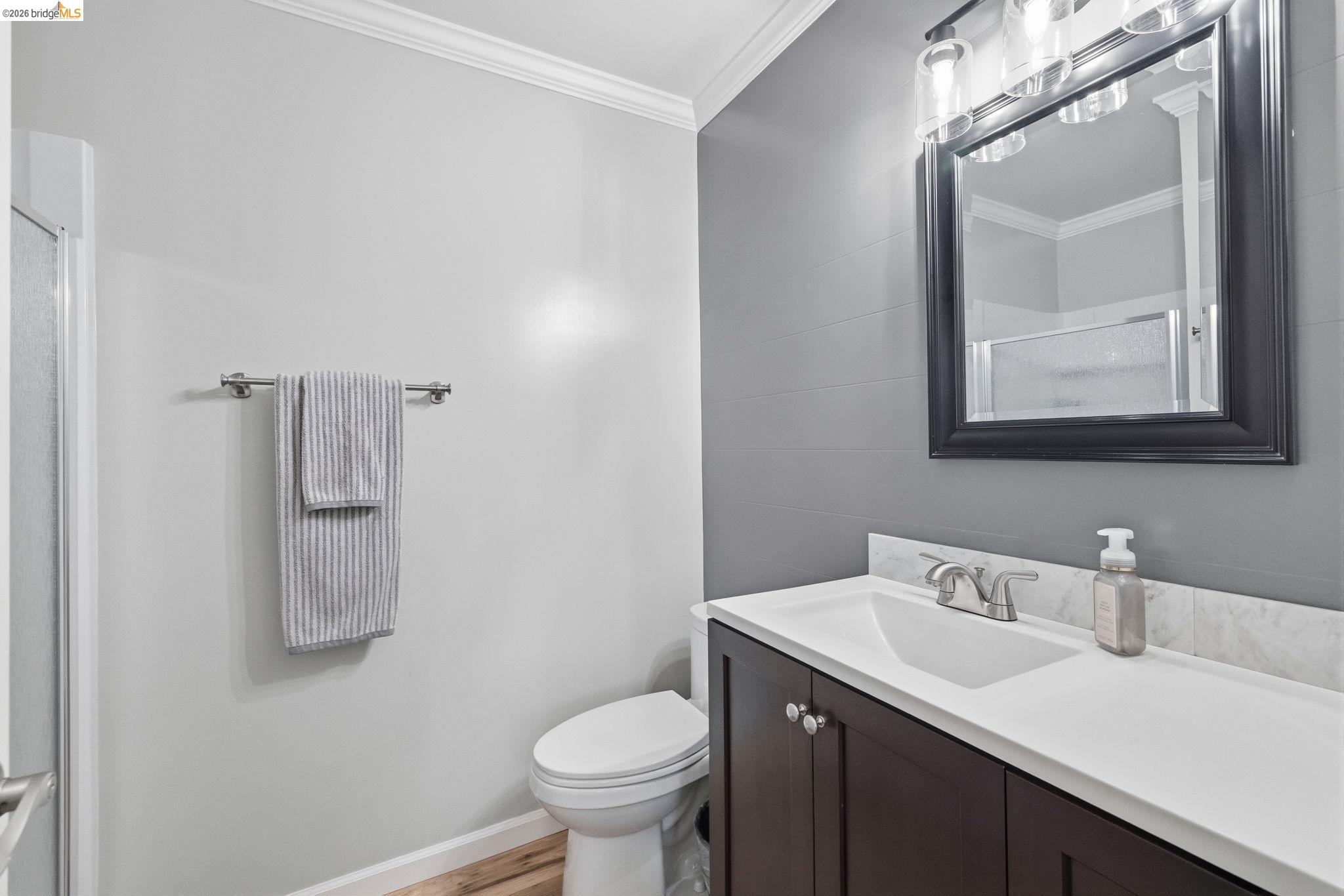 19059 Raboul Court Groveland, CA 95321 - Photo 13 of 21 Bathroom vanity featuring a white undermount sink and a white countertop with an integrated backsplash
