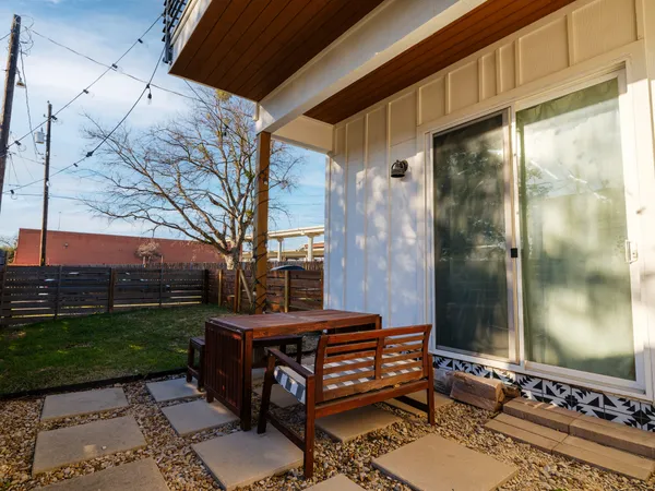 a view of a backyard with sitting area