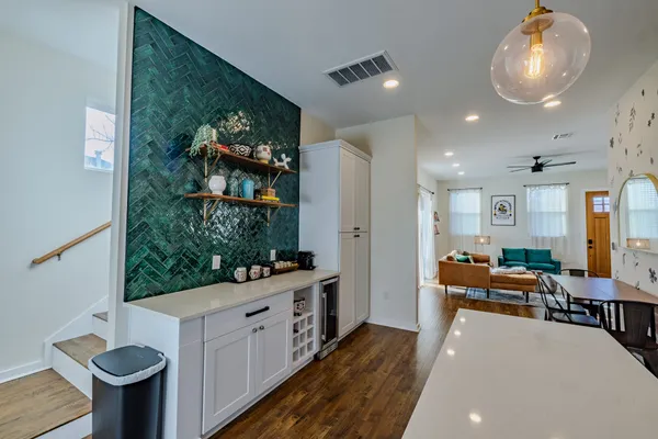 a very nice looking room with kitchen area