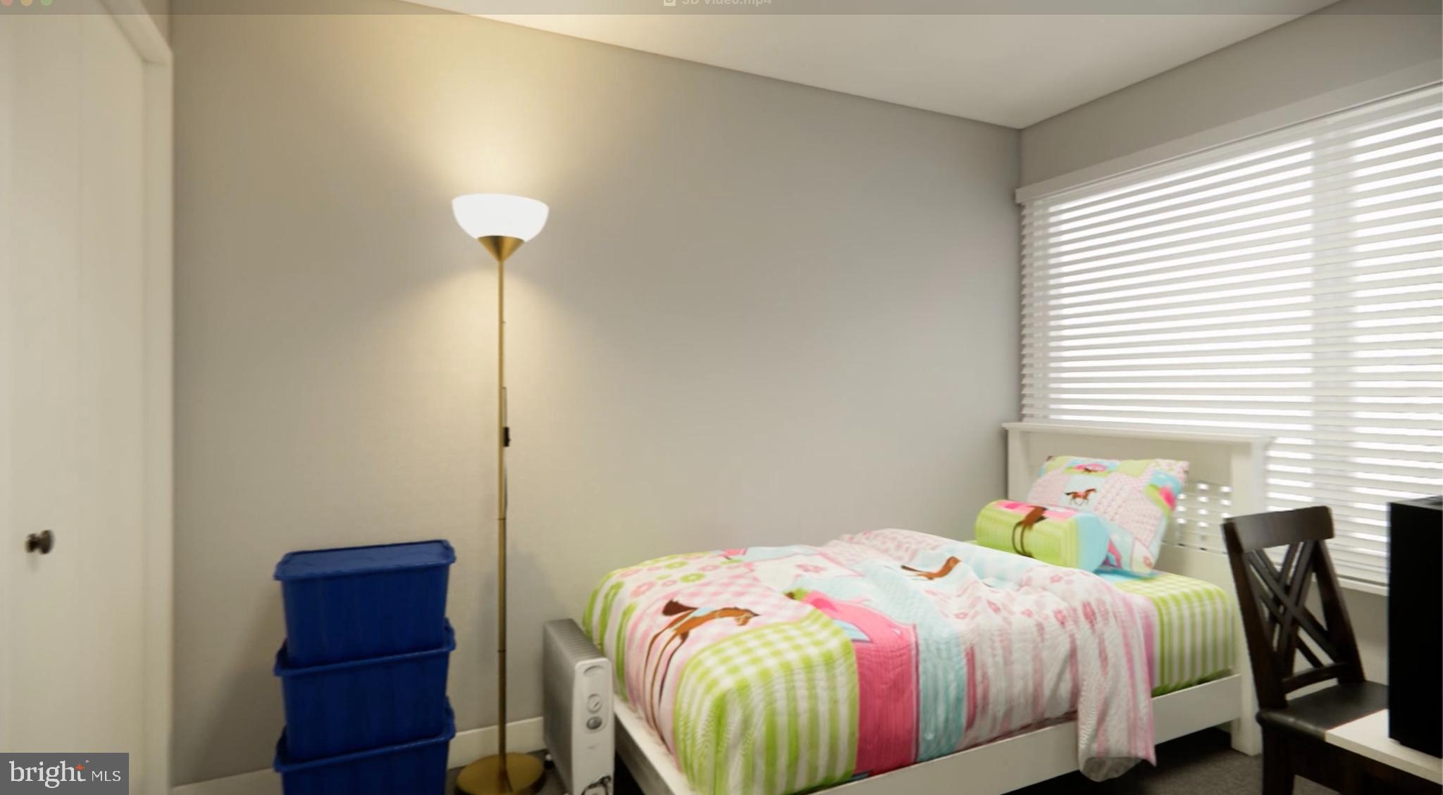 8007 Mandan Road, Unit 203 Greenbelt, MD 20770 - Photo 15 of 25 a bedroom with a bed and a window