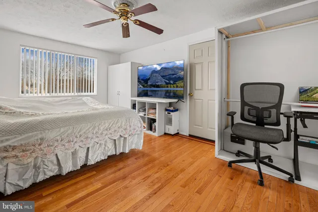 a bedroom with furniture and a window