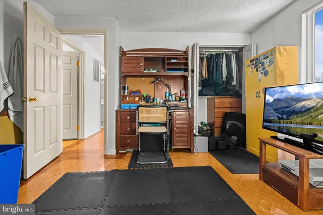 a view of living room kitchen with furniture and flat screen tv