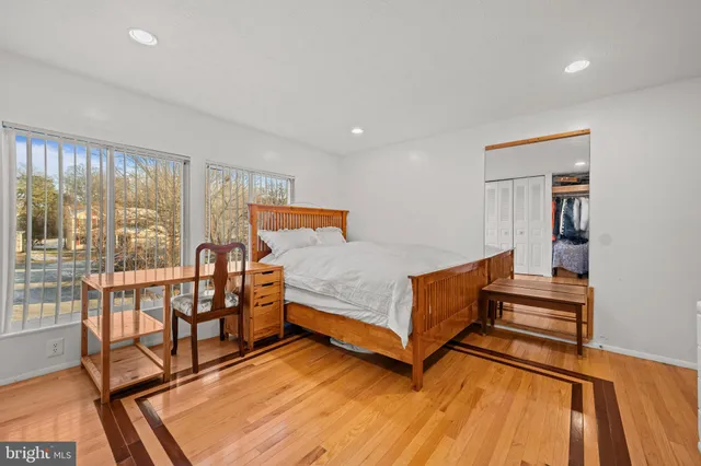 a bedroom with furniture and a window