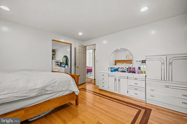 a bedroom with a bed and a dresser