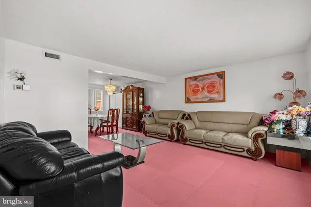 a living room with furniture and a couch