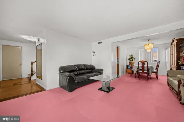 a living room with furniture and a table