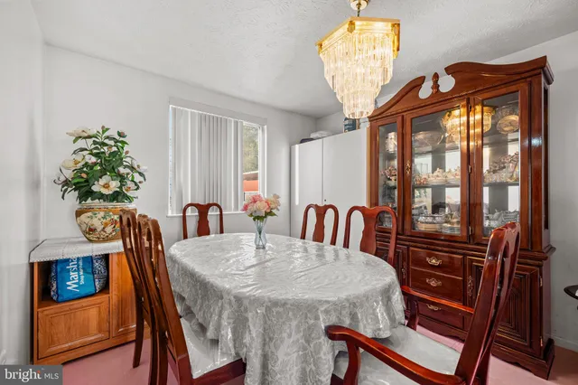 a view of a dining room with furniture and window