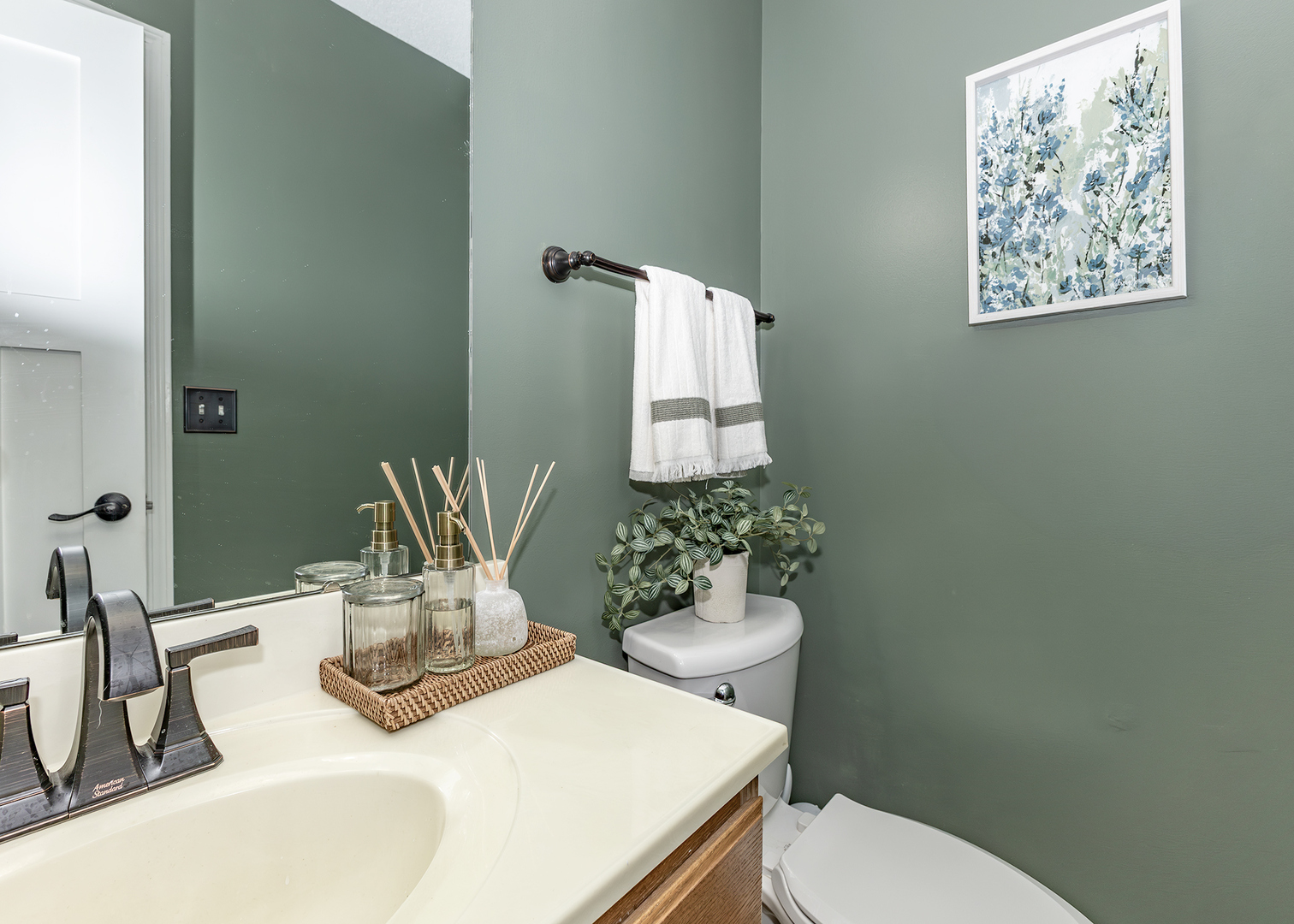 57 Deer Path Court Geneseo, IL 61254 - Photo 14 of 32 a bathroom with a toilet sink and mirror