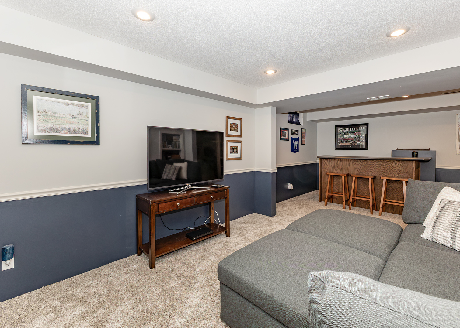57 Deer Path Court Geneseo, IL 61254 - Photo 24 of 32 a living room with furniture and a flat screen tv