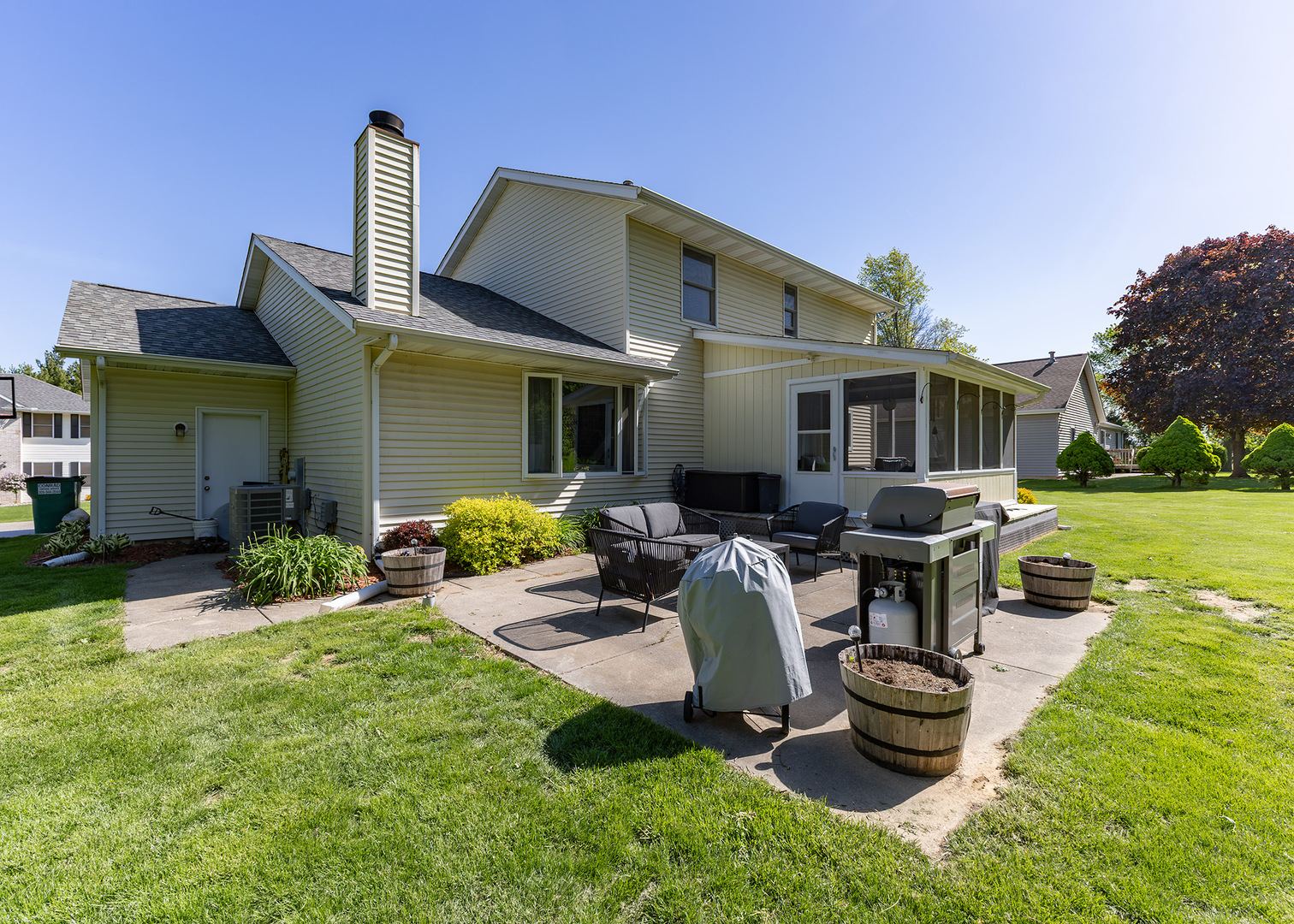 57 Deer Path Court Geneseo, IL 61254 - Photo 29 of 32 a front view of house with yard and outdoor seating