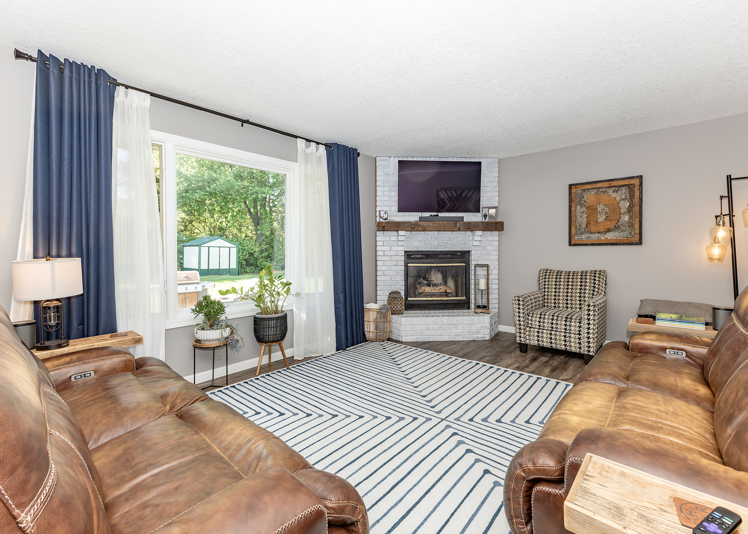 57 Deer Path Court Geneseo, IL 61254 - Photo 6 of 32 a living room with furniture large window and a fireplace