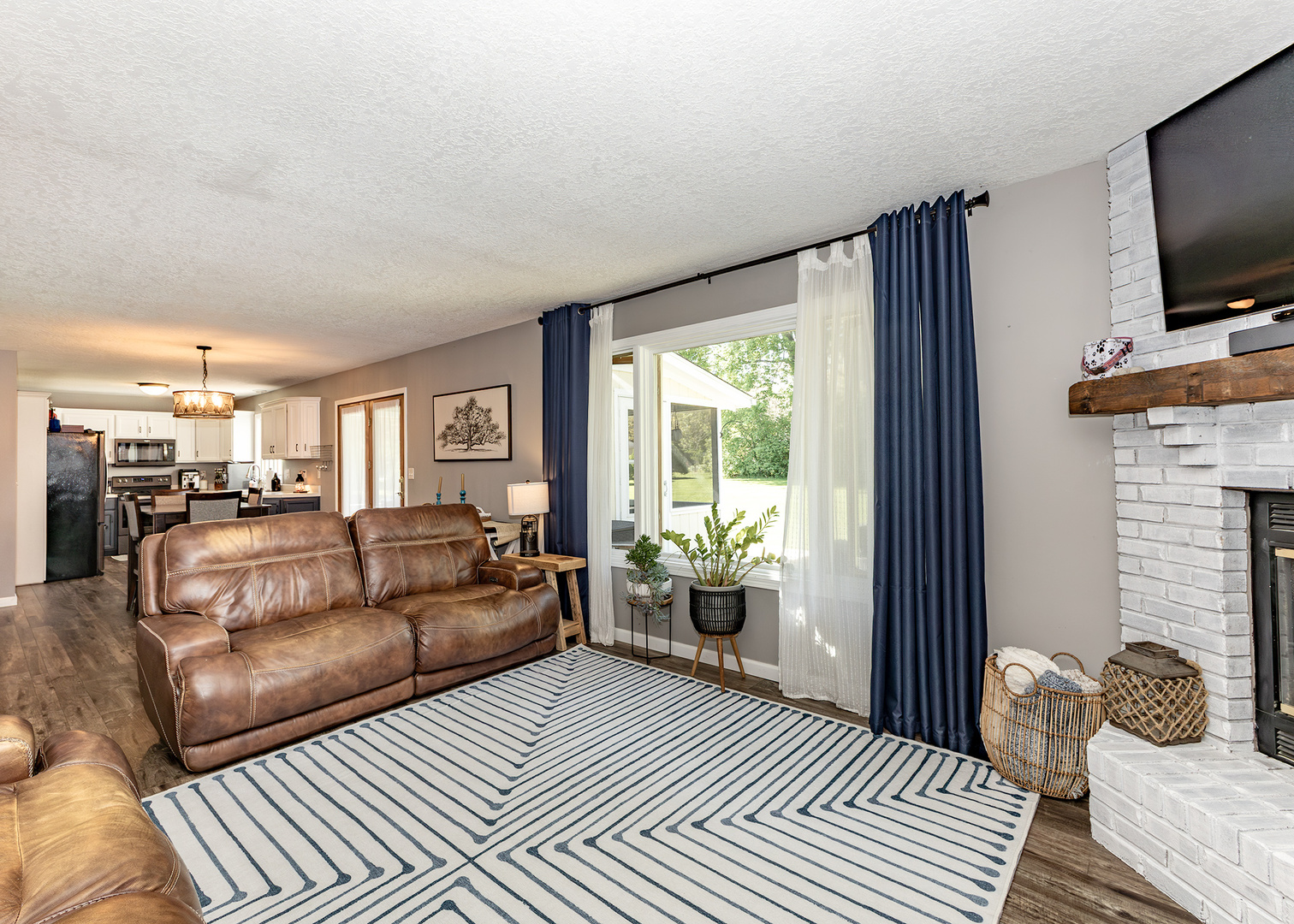 57 Deer Path Court Geneseo, IL 61254 - Photo 7 of 32 a living room with furniture and a flat screen tv