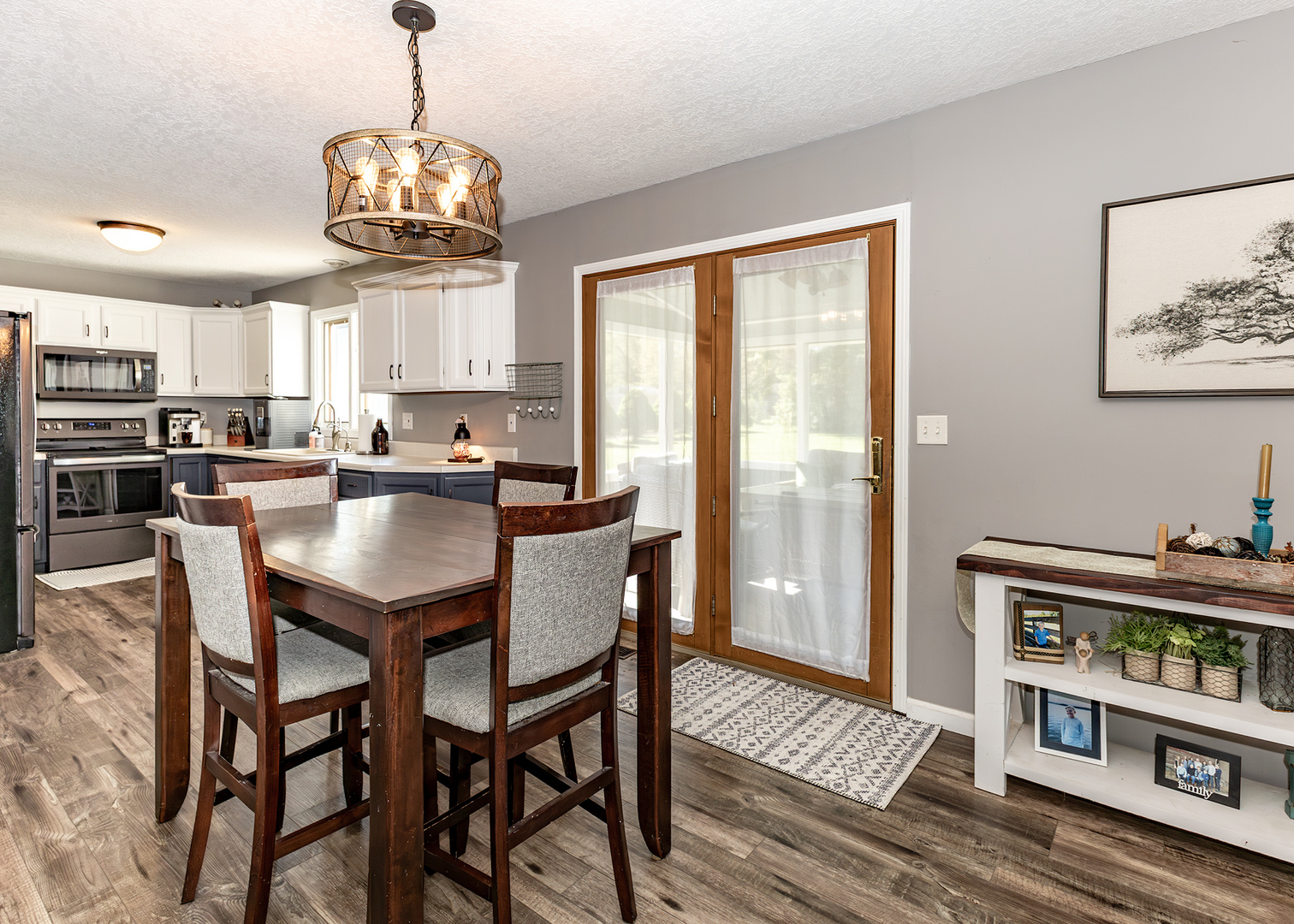 57 Deer Path Court Geneseo, IL 61254 - Photo 9 of 32 a view of a dining room with furniture a chandelier and wooden floor