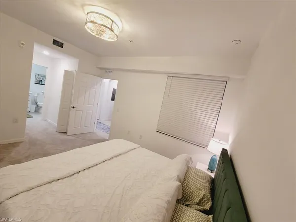 a bathroom with a sink toilet and a mirror