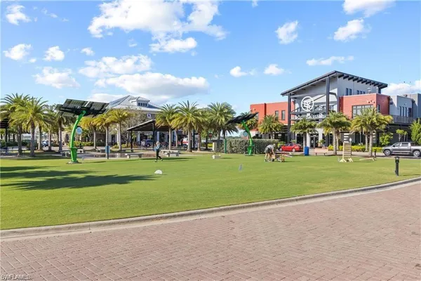 a view of a swimming pool with outdoor seating