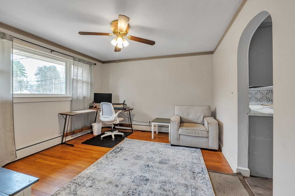109 North Brookfield Road Barre, MA 01005 - Photo 11 of 42 a living room with furniture a chandelier and a rug