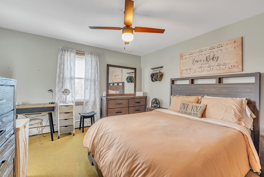 109 North Brookfield Road Barre, MA 01005 - Photo 15 of 42 a bedroom with a bed and a chandelier