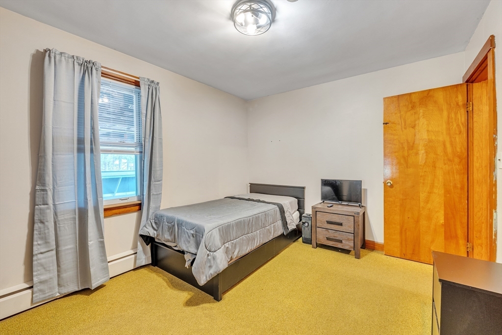 109 North Brookfield Road Barre, MA 01005 - Photo 17 of 42 a spacious bedroom with a bed and a window