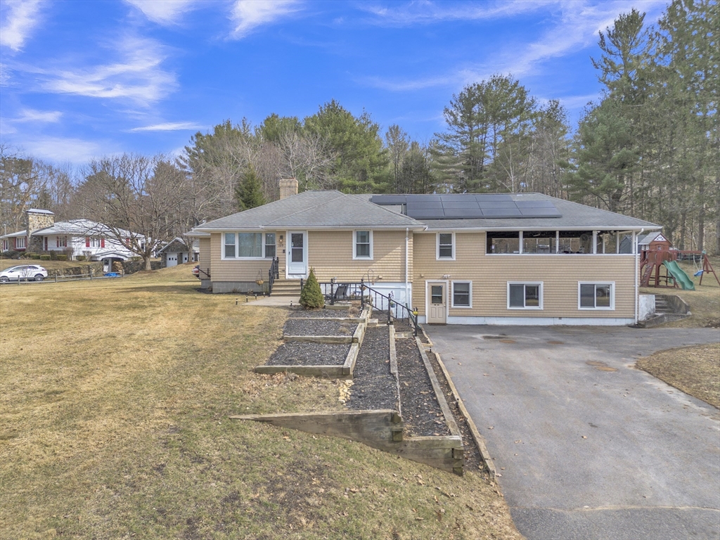 109 North Brookfield Road Barre, MA 01005 - Photo 2 of 42 a front view of a house with a yard table and chairs