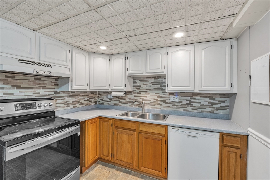 109 North Brookfield Road Barre, MA 01005 - Photo 23 of 42 a kitchen with granite countertop stainless steel appliances and white cabinets