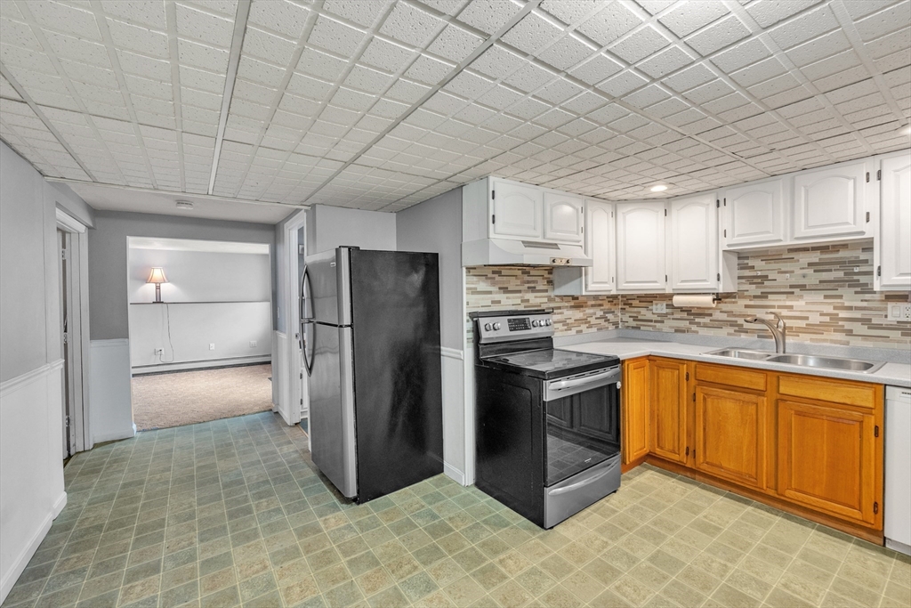 109 North Brookfield Road Barre, MA 01005 - Photo 25 of 42 a kitchen with stainless steel appliances granite countertop a refrigerator a sink and a stove