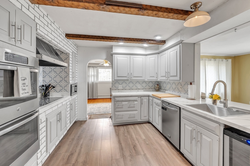 109 North Brookfield Road Barre, MA 01005 - Photo 4 of 42 a large kitchen with stainless steel appliances granite countertop a lot of counter space and wooden floors