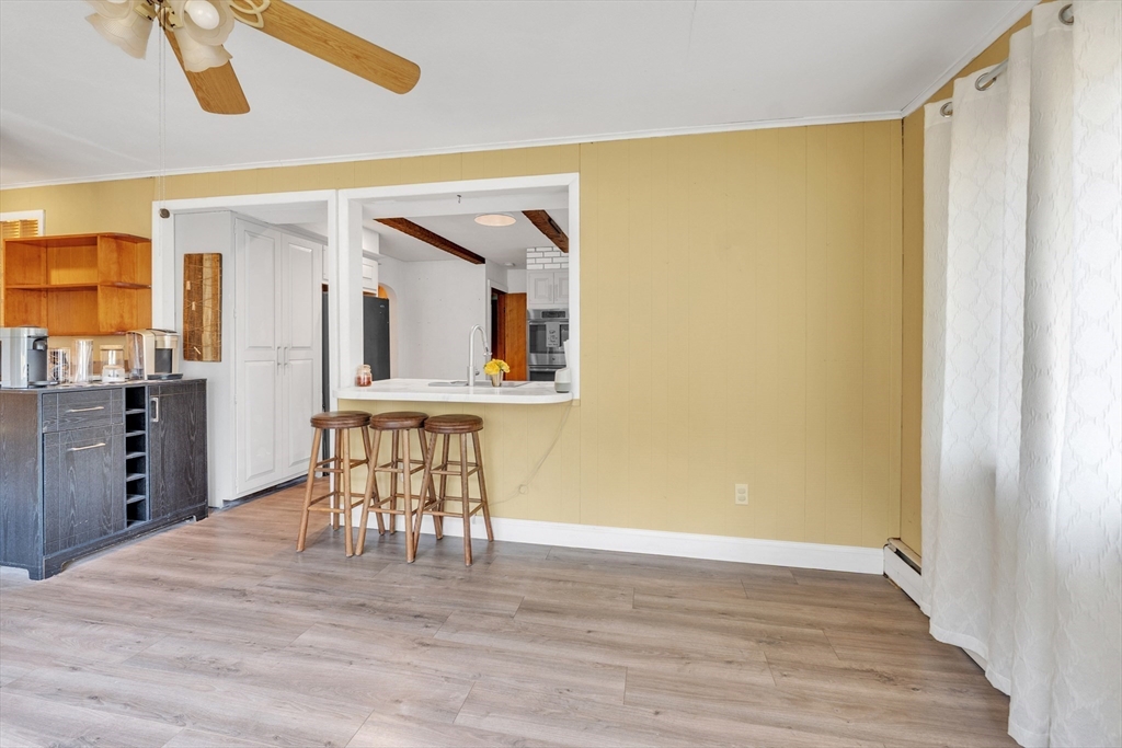 109 North Brookfield Road Barre, MA 01005 - Photo 10 of 42 a view of an empty room with wooden floor and a window