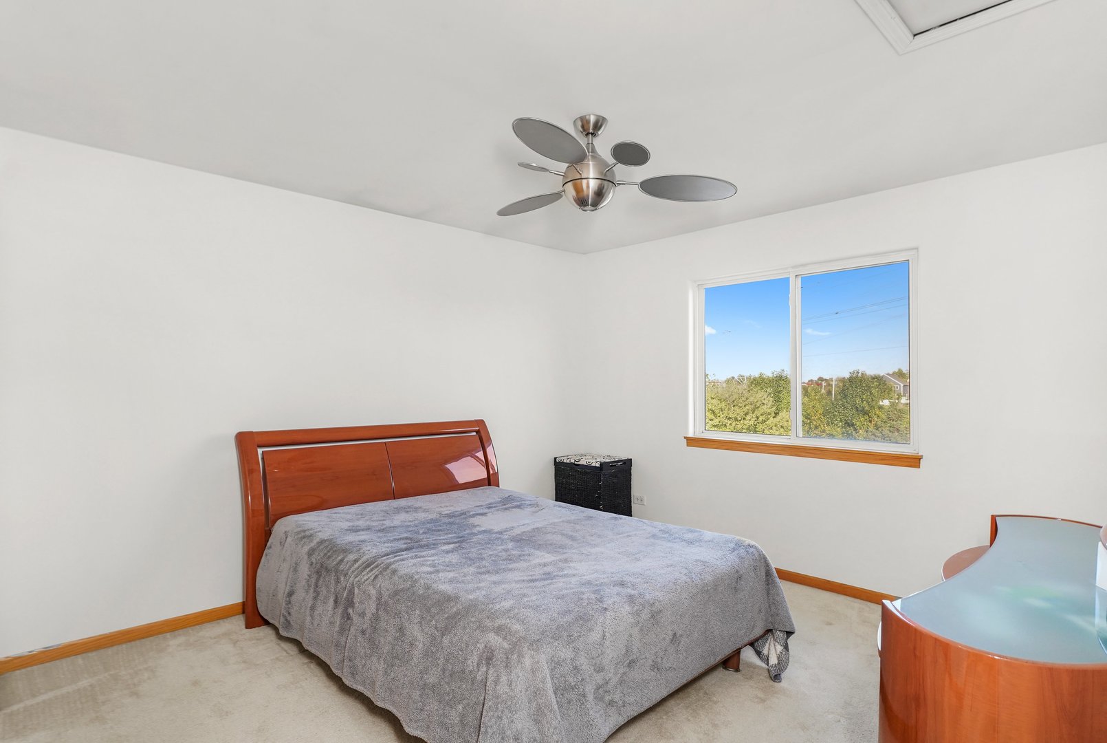 1514 Spring Oaks Drive Joliet, IL 60431 - Photo 17 of 36 a bedroom with a bed and a chandelier