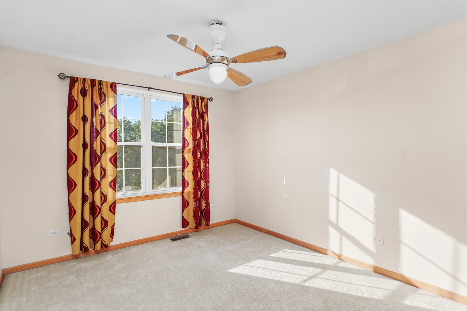 1514 Spring Oaks Drive Joliet, IL 60431 - Photo 18 of 36 an empty room with window and ceiling fan
