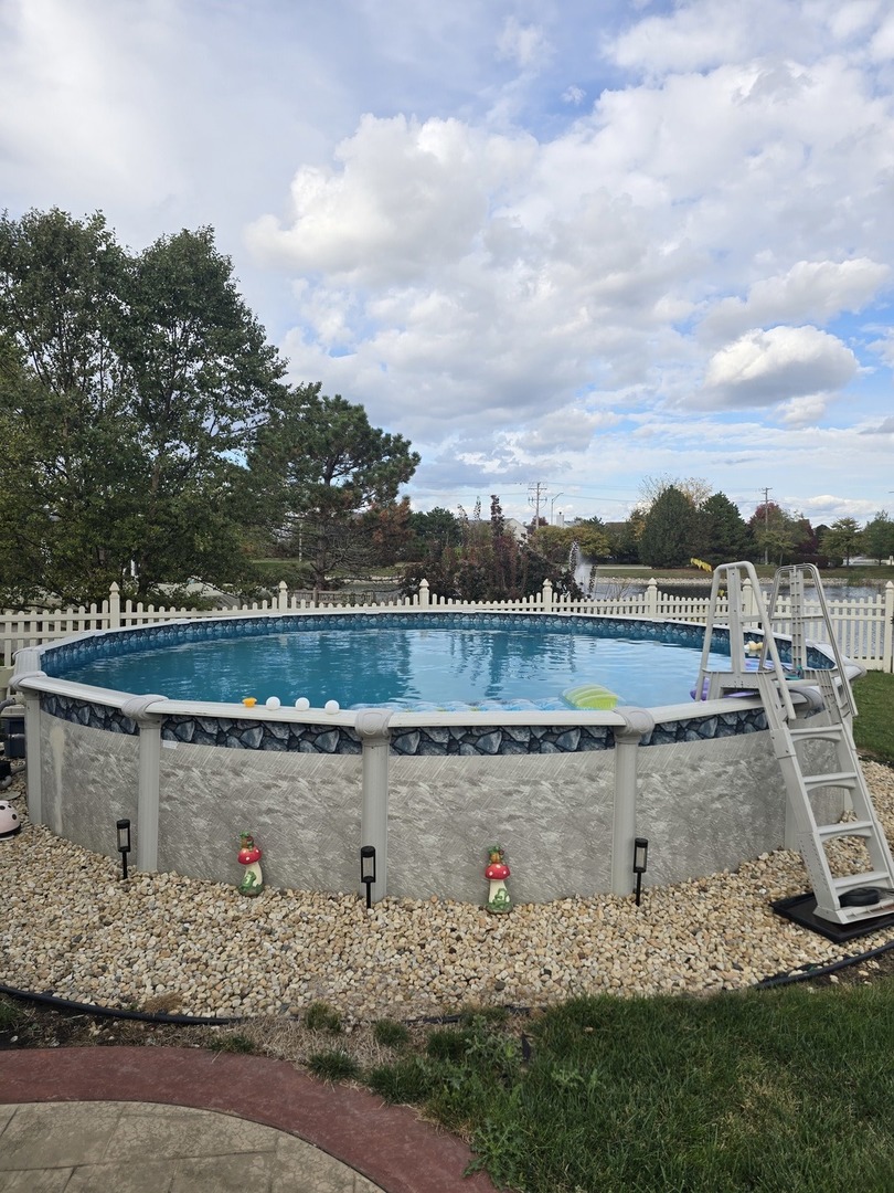 1514 Spring Oaks Drive Joliet, IL 60431 - Photo 26 of 36 a view of a lake with houses
