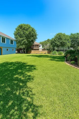 a view of a house with a big yard