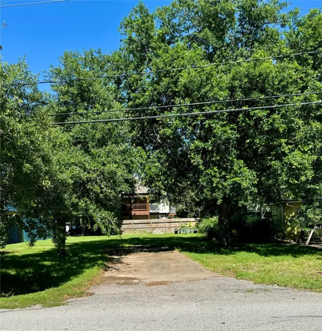 a backyard of a house with a garden and plants