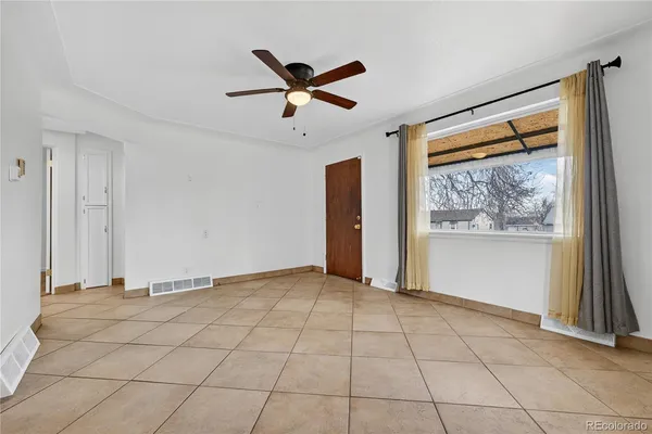 a view of an empty room with a window