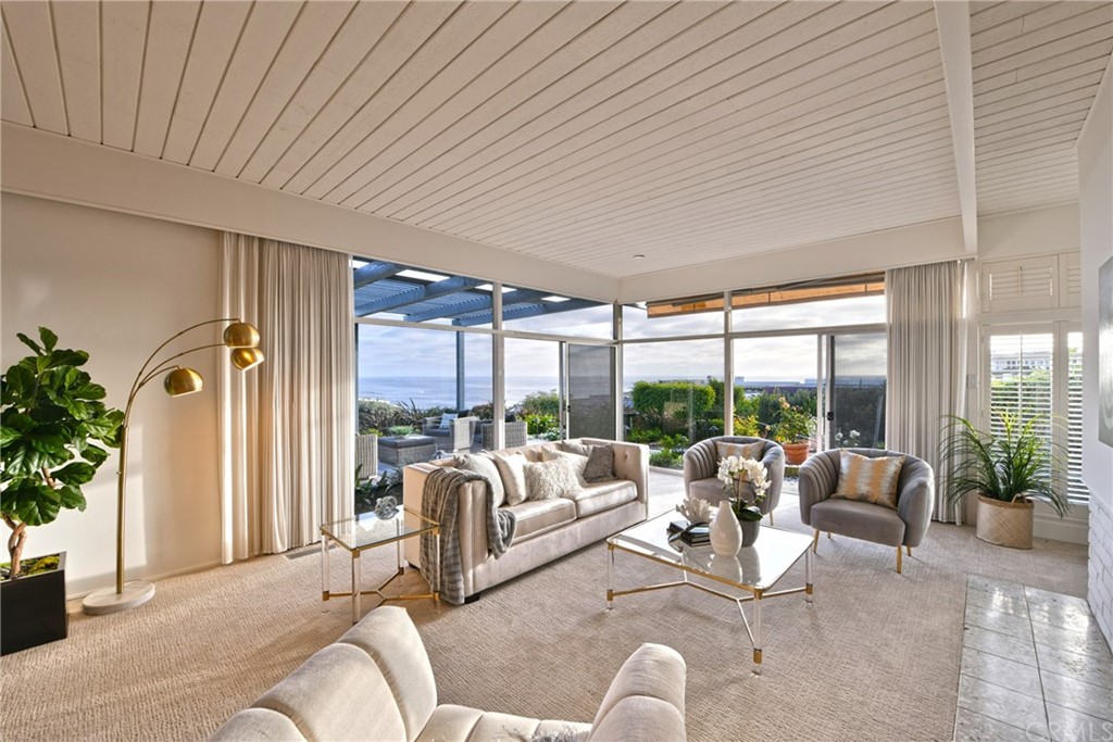 408 Monarch Bay Drive Dana Point, CA 92629 - Photo 12 of 42 a living room with furniture and a large window