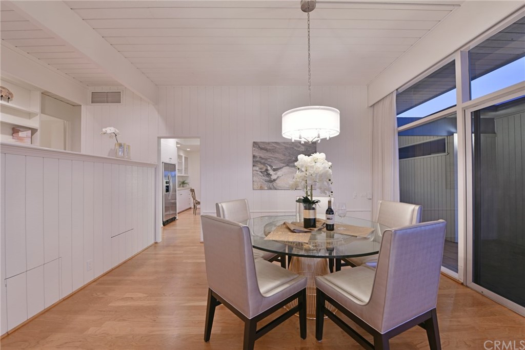 408 Monarch Bay Drive Dana Point, CA 92629 - Photo 15 of 42 a dining room with furniture a chandelier and wooden floor