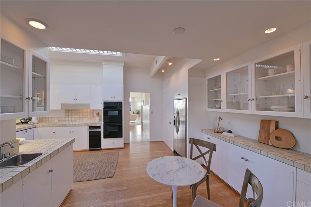 408 Monarch Bay Drive Dana Point, CA 92629 - Photo 17 of 42 a spacious bathroom with a granite countertop sink and a mirror