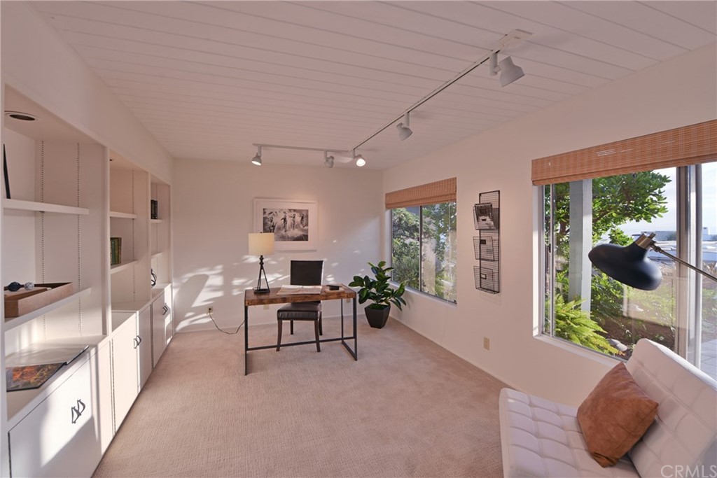 408 Monarch Bay Drive Dana Point, CA 92629 - Photo 19 of 42 a living room with furniture and a large window