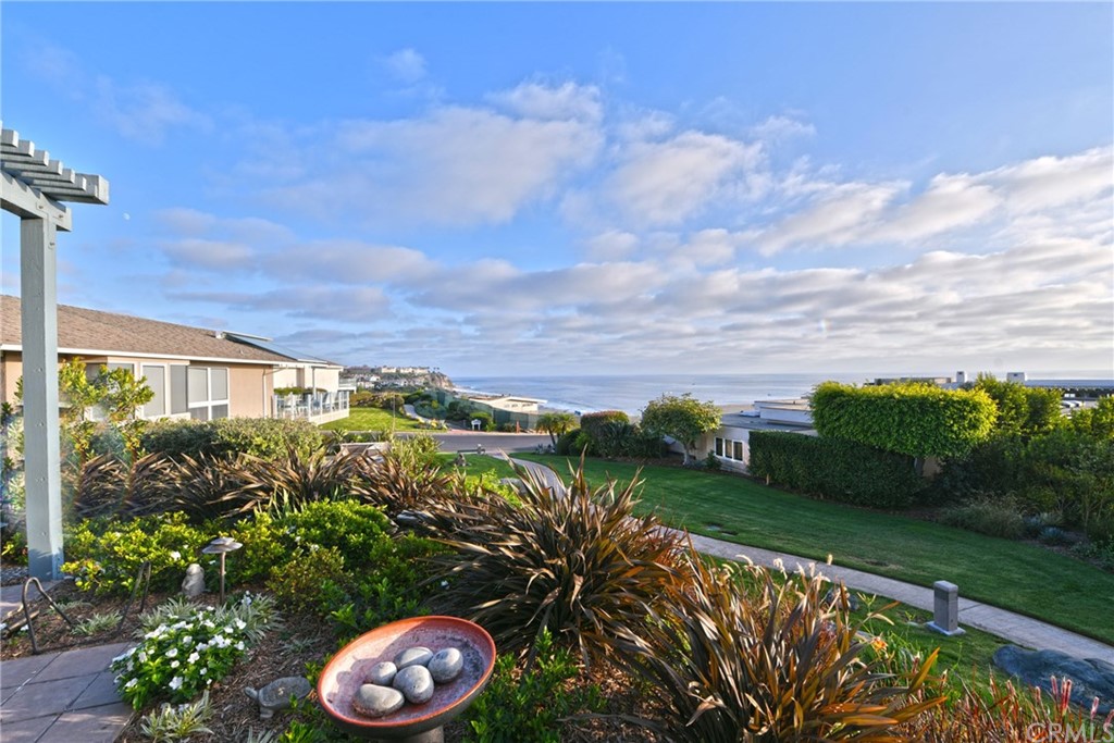 408 Monarch Bay Drive Dana Point, CA 92629 - Photo 29 of 42 a view of a garden with a building in the background
