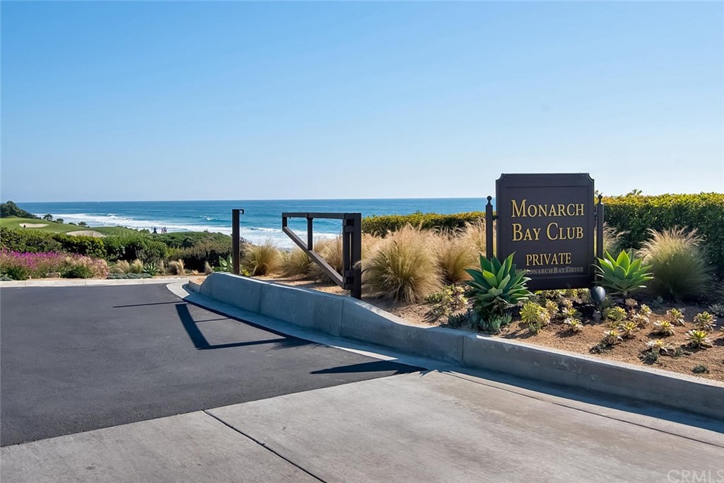 408 Monarch Bay Drive Dana Point, CA 92629 - Photo 36 of 42 a wooden bench sitting in front of a building